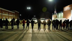 Protestors demonstrate in front of Ferguson Police Station