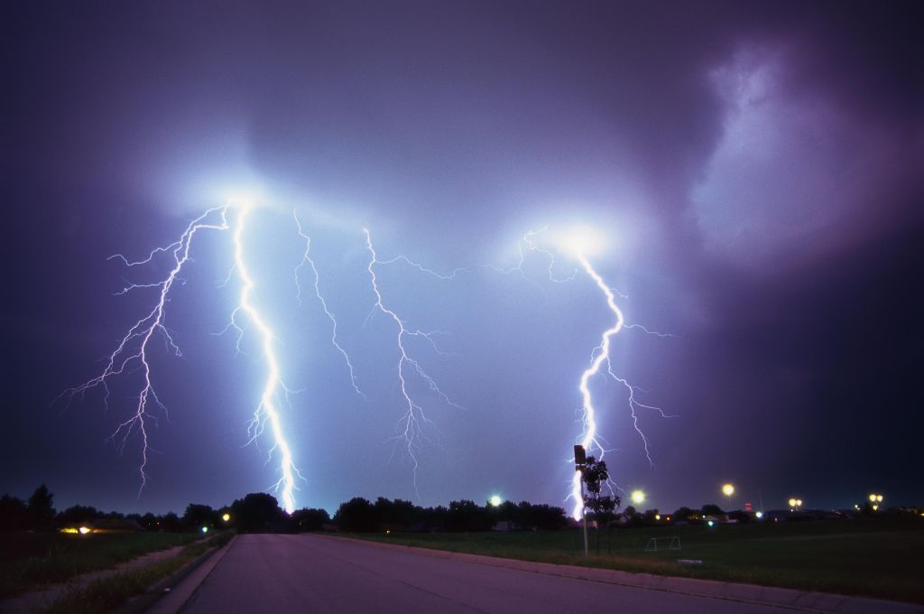 tungsten shot of a bolt of lightning hitting the ground