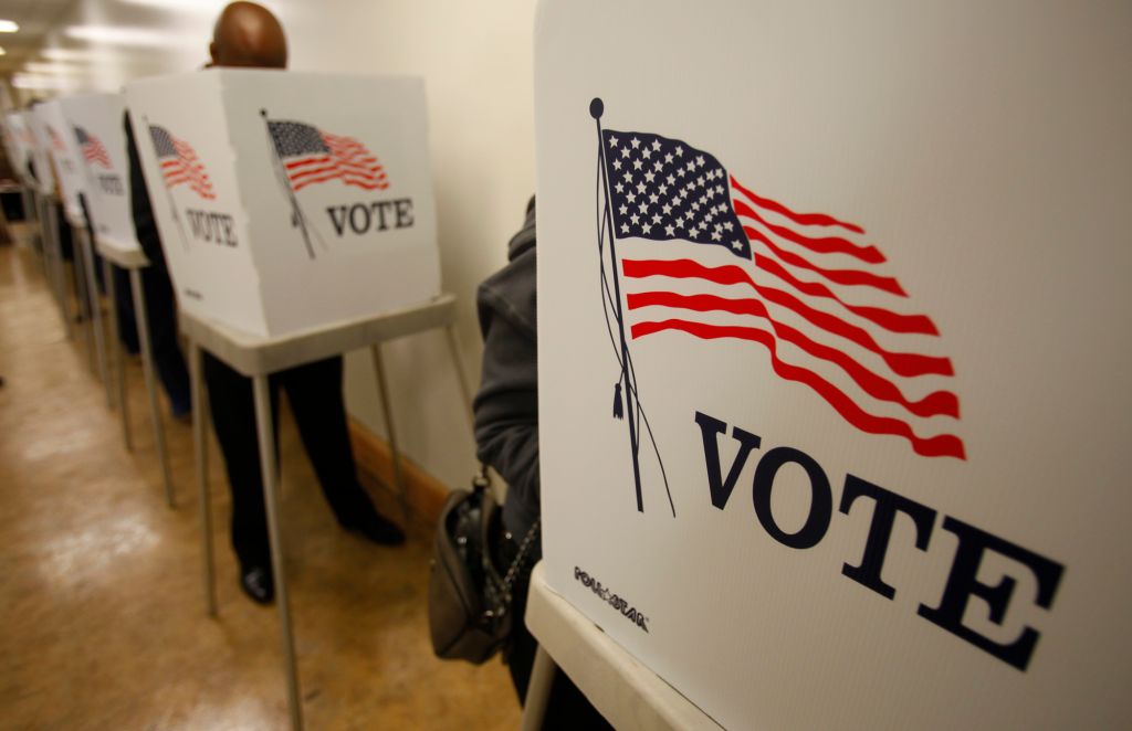 Early voters line-up before dawn at the Los Angeles County Registrar of Voters Office in Norwalk to