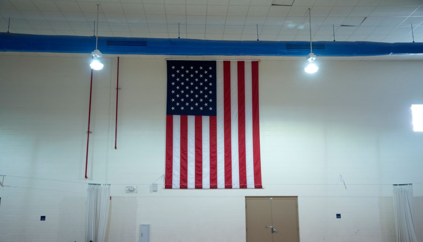 American flag in a school gym