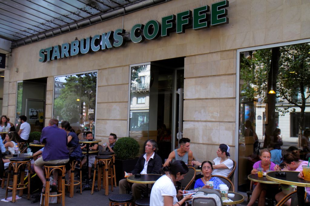Paris, Boulevard de Sbastopol Starbucks Coffee tables chairs customers alfresco