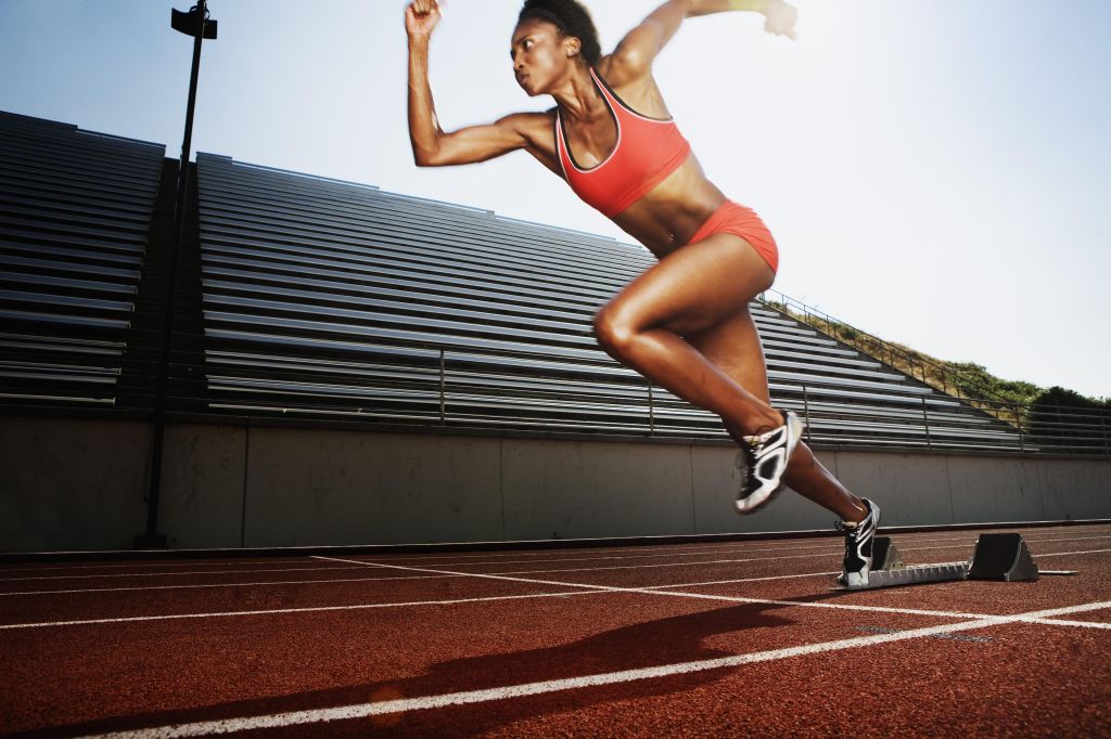 Women running on athletic track