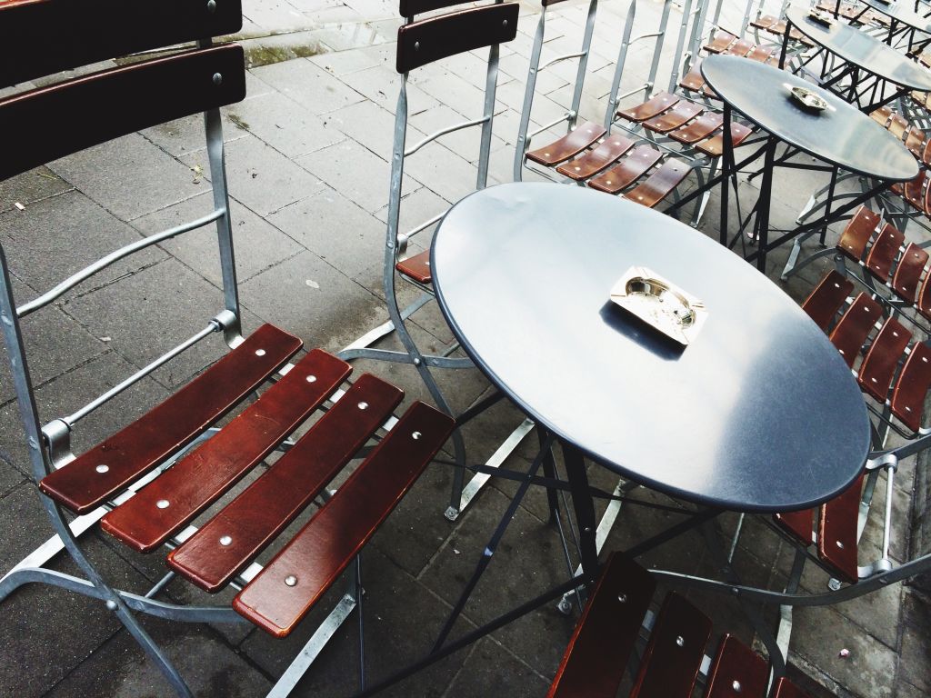 Empty Chairs And Tables Outdoors