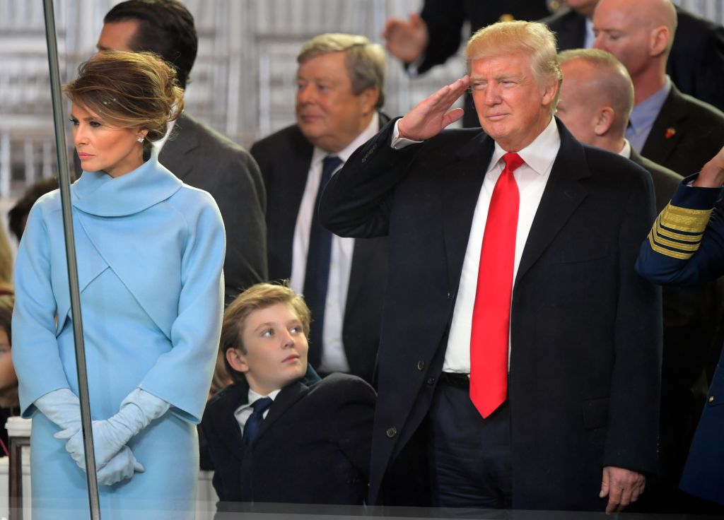 Newly sworn in President Donald Trump with his wife Melania walk down Pennsylvania Avenue in front of the White House