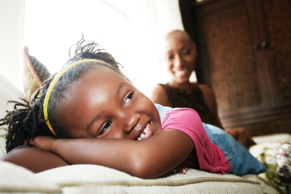 Black girl laying on sofa