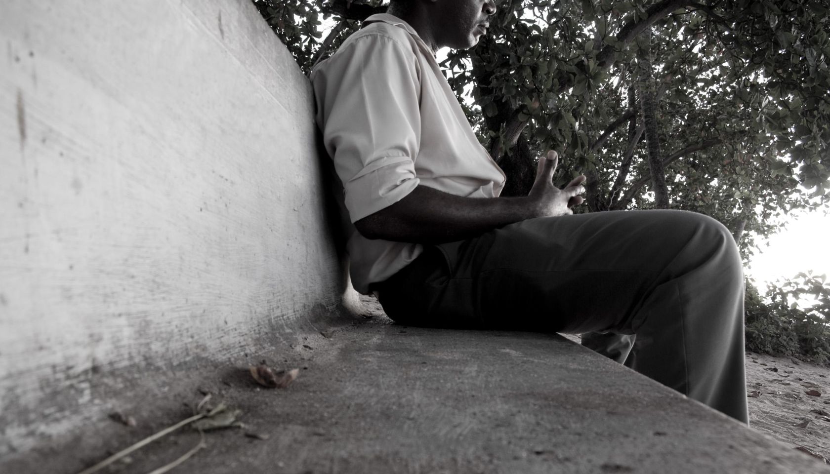 man sitting on outdoor park bench