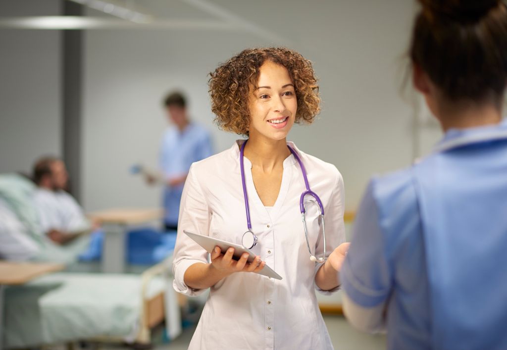 female doctor in team meeting