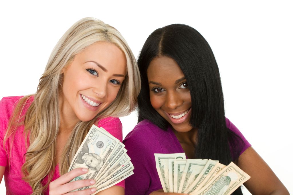 two young women with cash