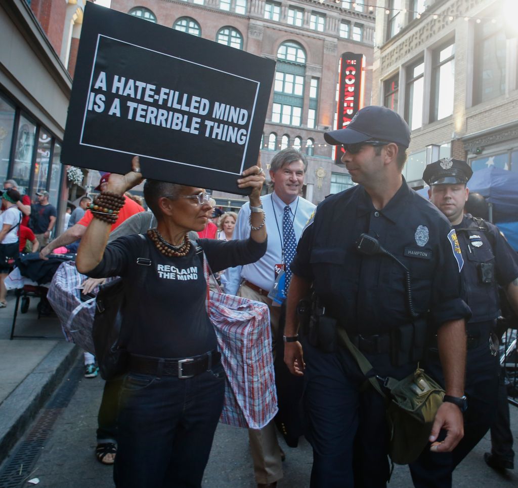 Activist with Stop Patriarchy with Cleveland police officer...