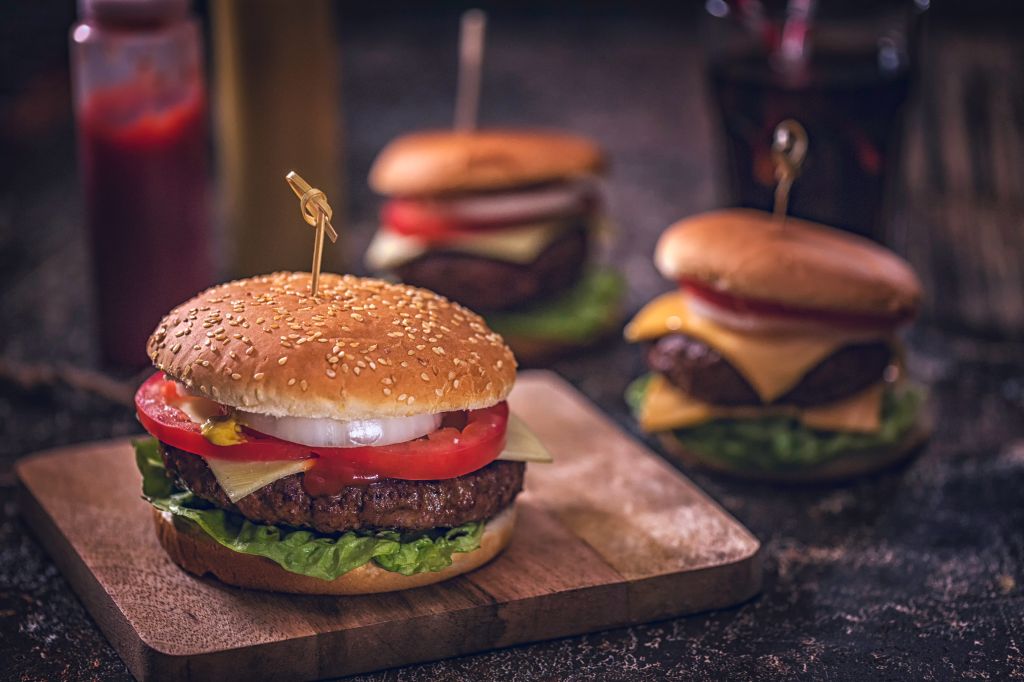 Homemade Burgers with Tomatoes, Onions and Salad