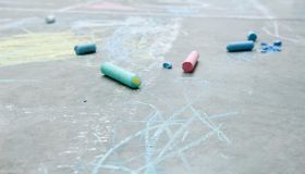 Chalk and drawings on the ground, close-up