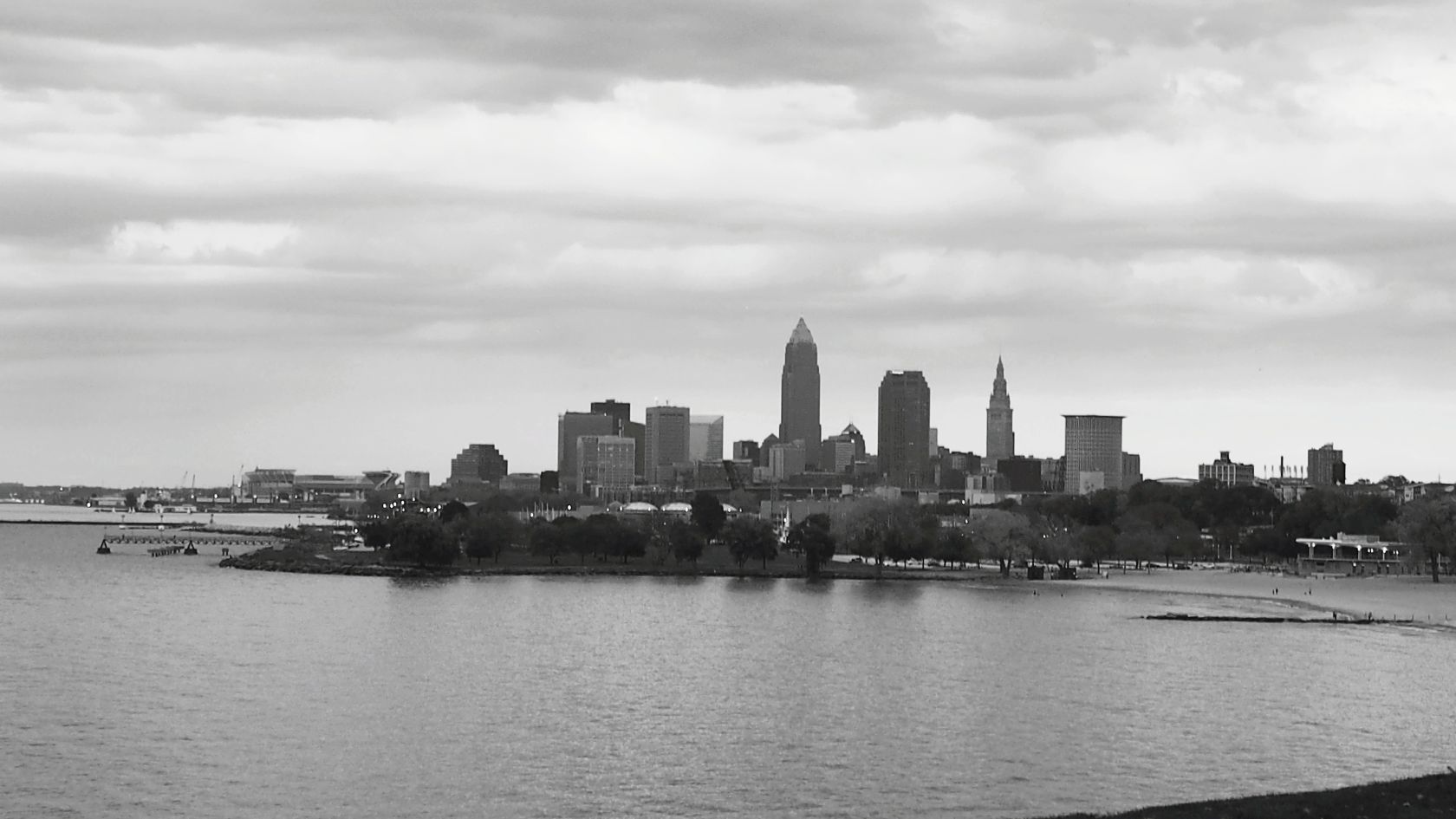 River By Cityscape Against Sky