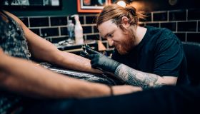 Tattooing a Man's Arm