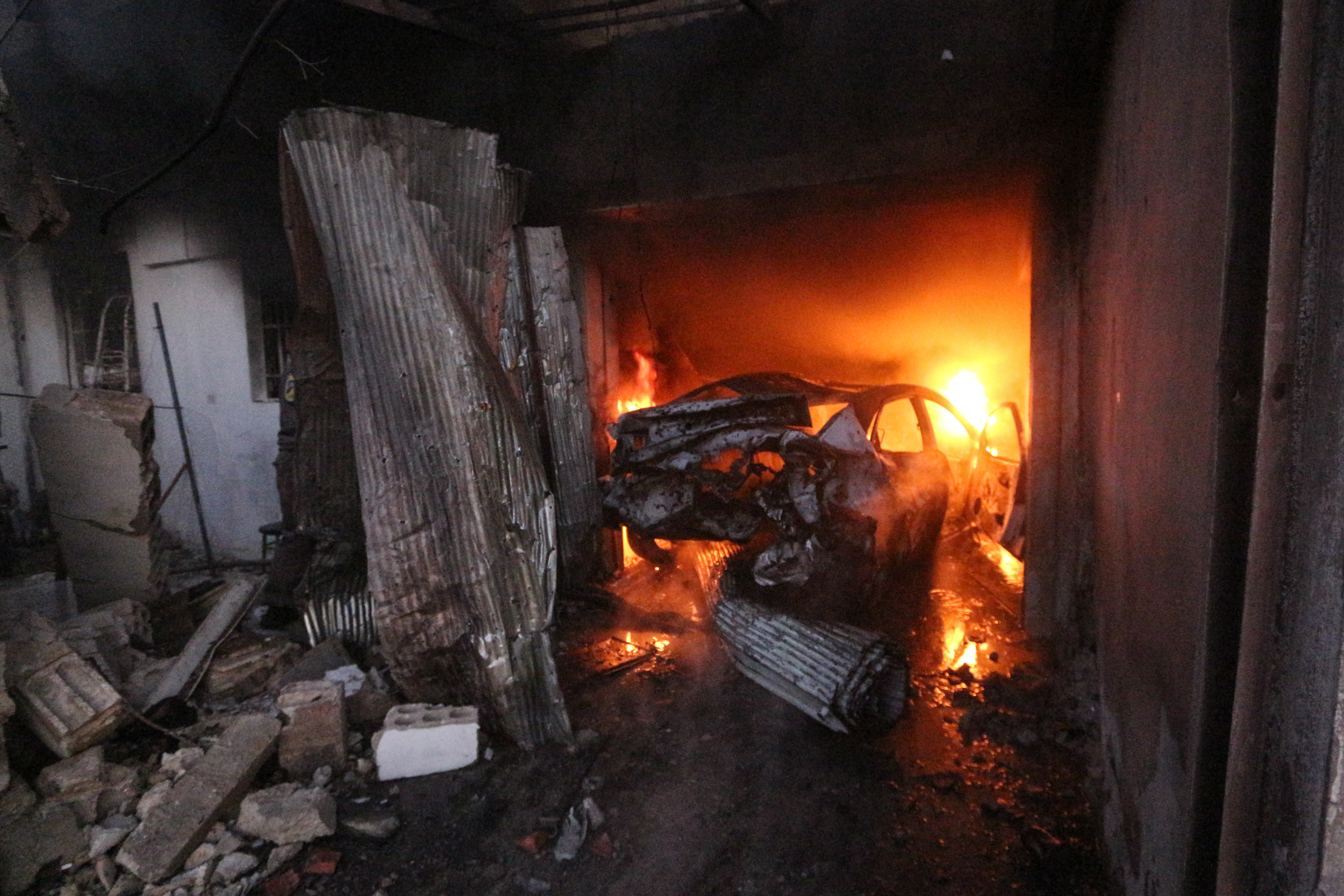 The car that was located in the garage of the house has...