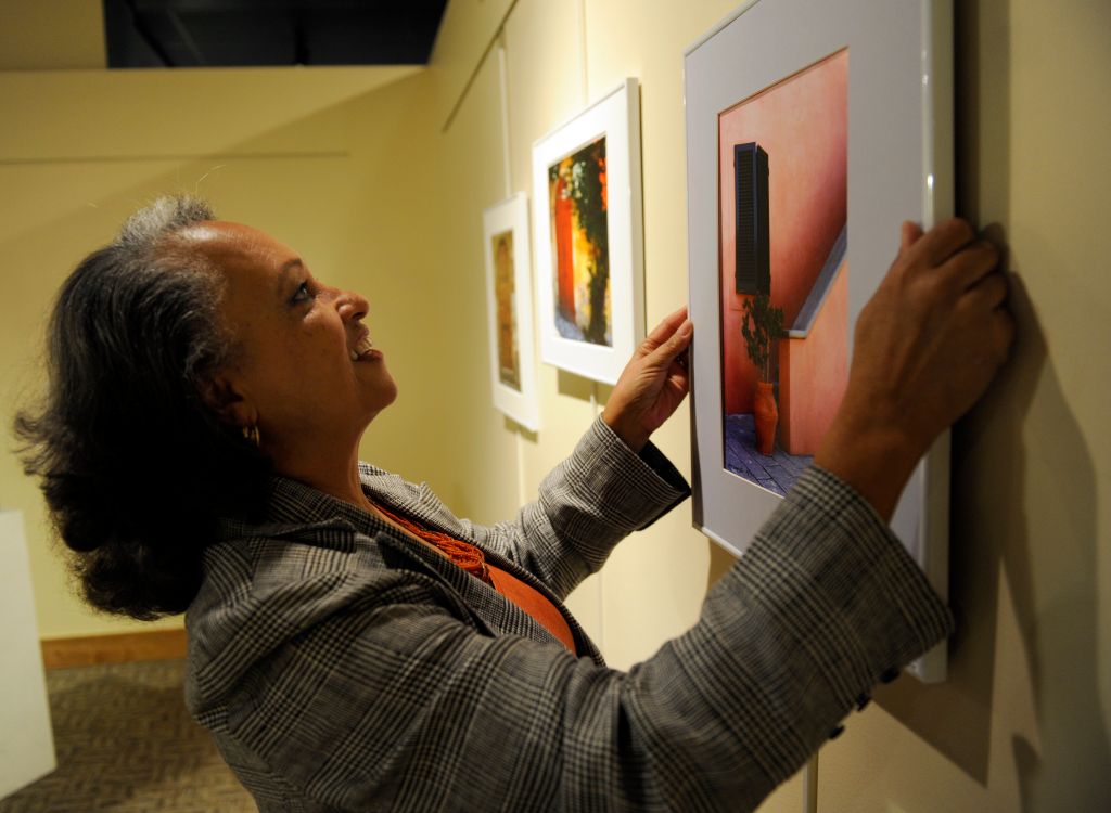 DENVER,CO--November 20Th 2009--Actress/photographer, Daphne Maxwell Reid, hangs one of her pictures at the Blair Caldwell African American Research Library Saturday evening. Reid was in town for her photographic exhibit entitled, 'Stepping Into the Future