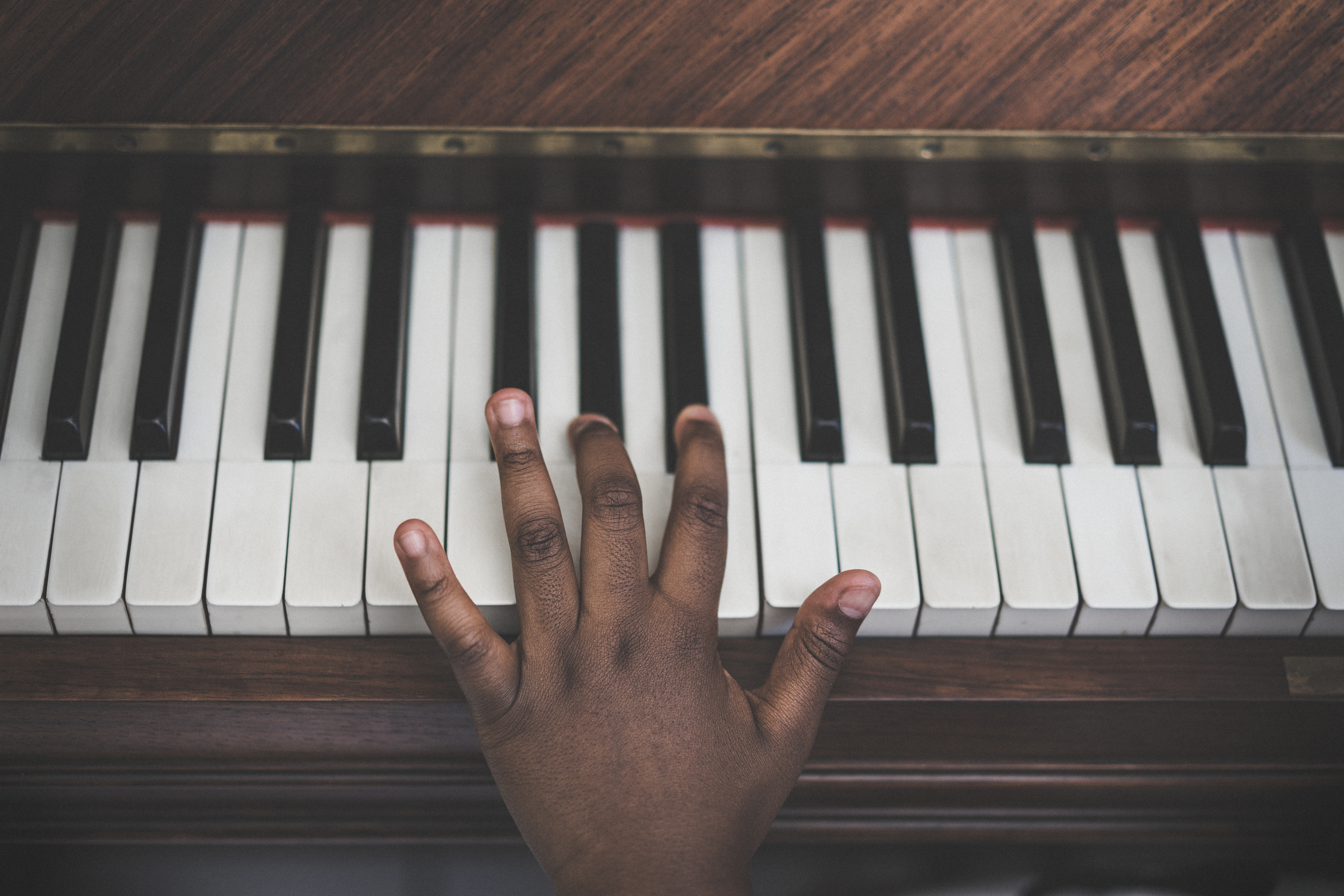 Cropped Hand Playing Piano