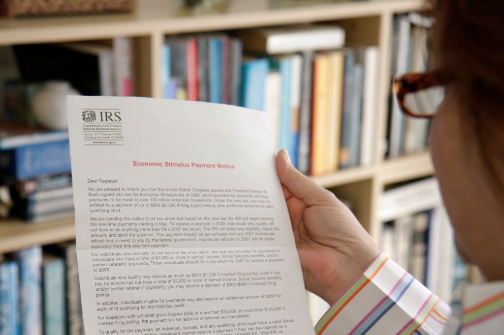 A woman reading a IRS document