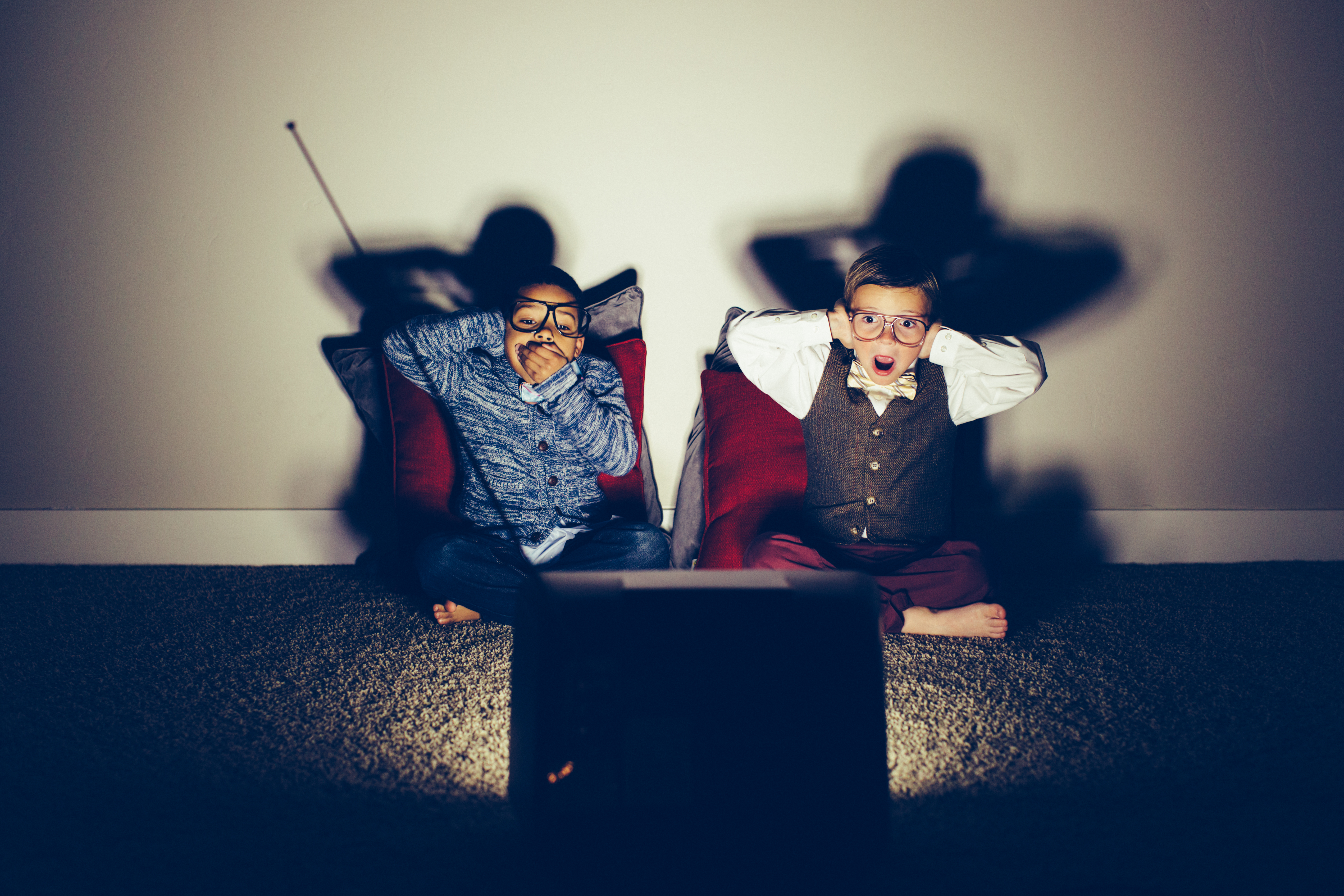 Two Surprised Young Nerds Watching Vulgar Television Show