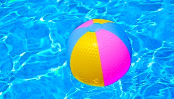 High Angle View Of Colorful Ball On Swimming Pool