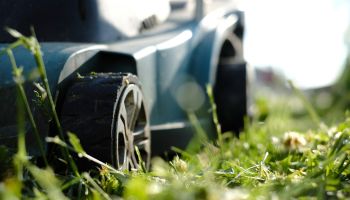 Close-up of a lawn mower on the grass