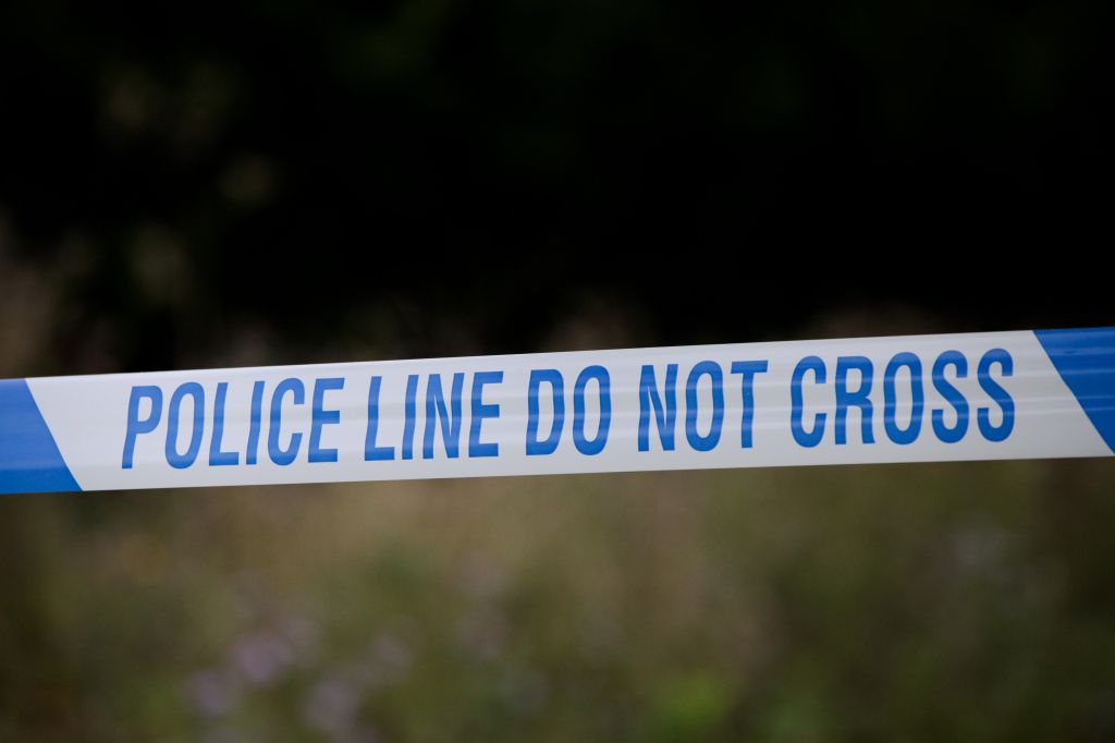 Cordons remain in place at the scene of a shooting in Haringey, north London, that left a man in his 20s fighting for his life in hospital