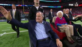 Former President George H.W. Bush performs coin toss at Super Bowl LI alongside Barbara Bush days after leaving the hospital.