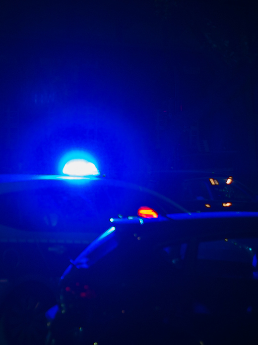 Blue Light Of Police Car In Street