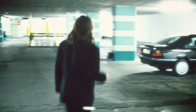A man in a parking garage