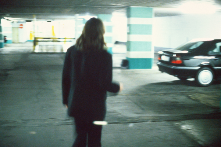 A man in a parking garage