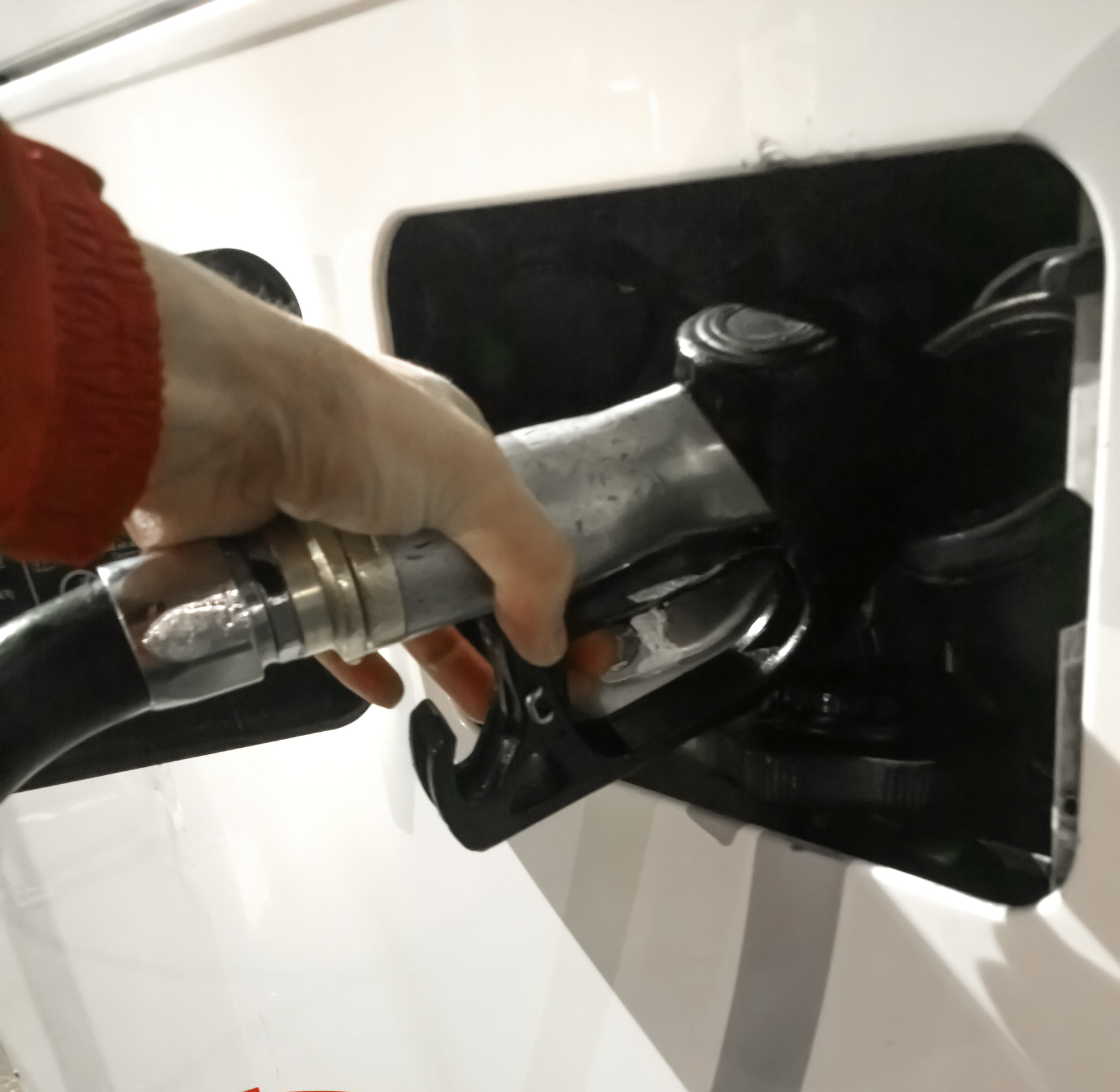 Hand refilling the Bus with fuel