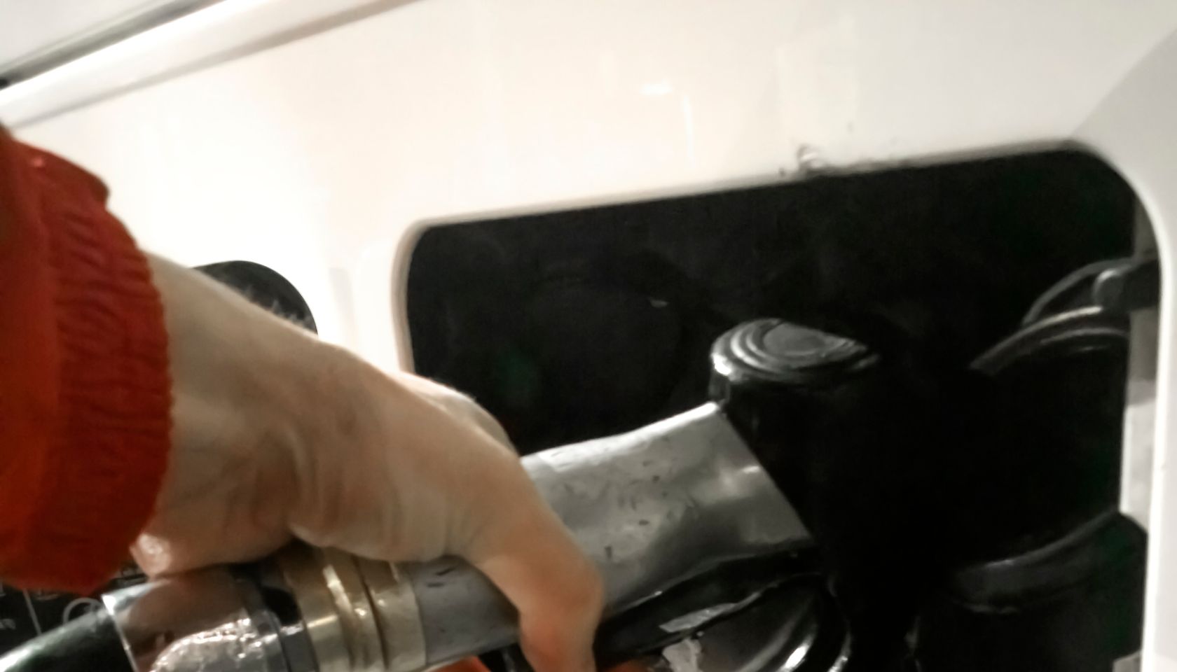 Hand refilling the Bus with fuel