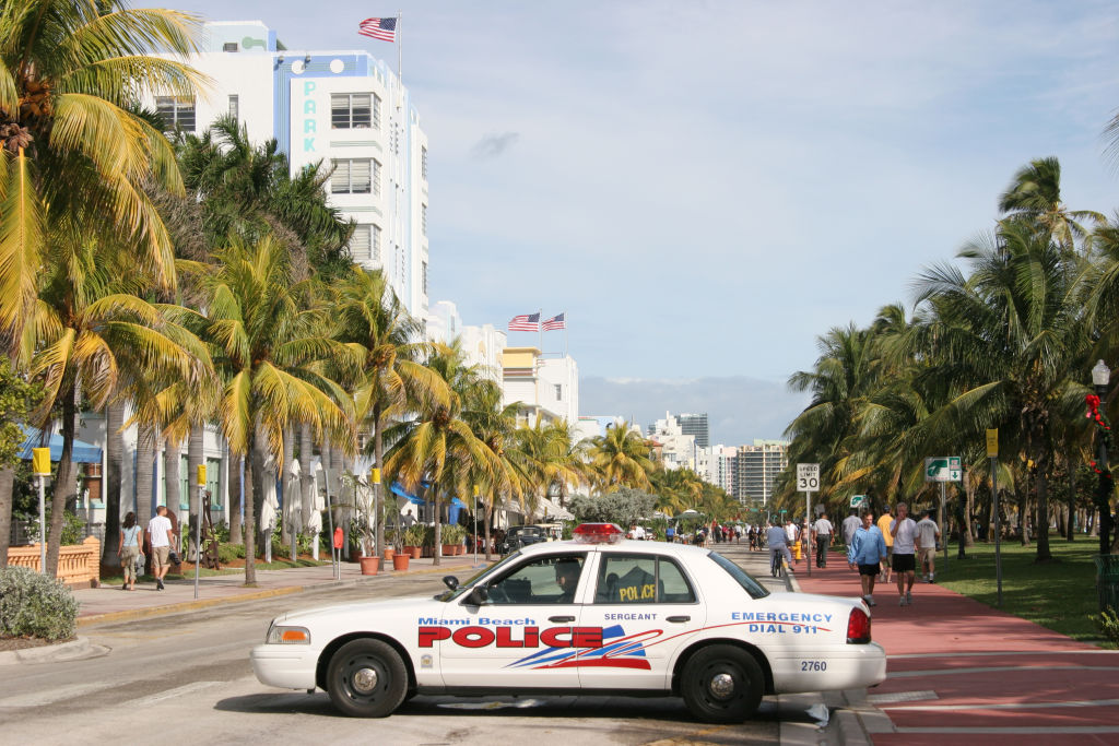 A police car parked on Ocean Drive.
