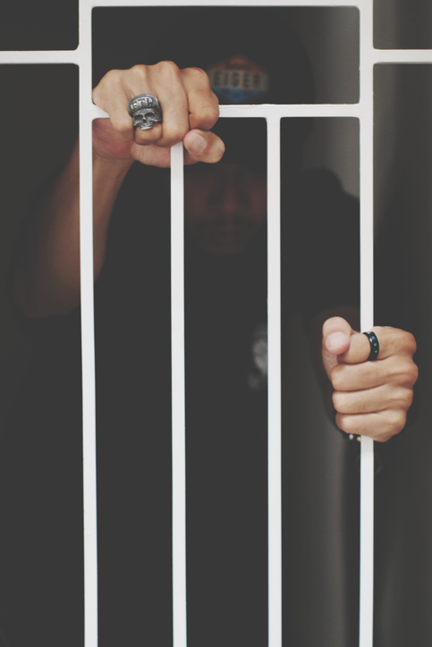 Man Holding Metal Grate