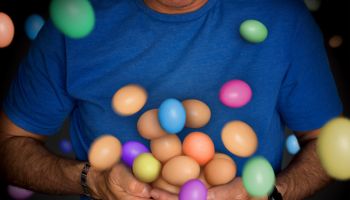 Midsection Of Man Holding Colorful Easter Eggs