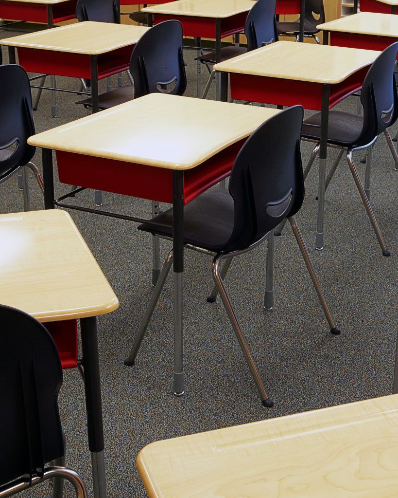 Desks and chairs in empty classroom