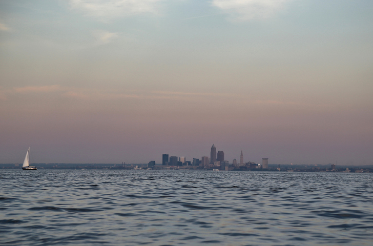 Long distance view of Cleveland city skyline frame Lake Erie
