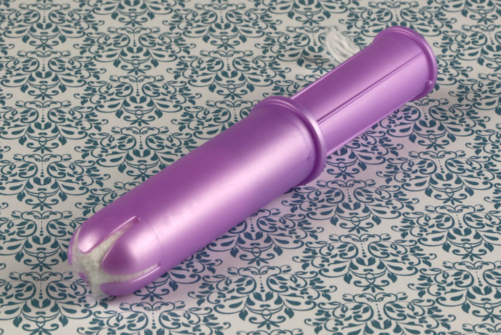 Tampon with plastic disposable applicator