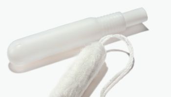 Tampon and plastic disposable applicator