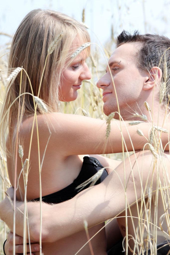 Close-Up Of Couple Cuddling In Sunny Day