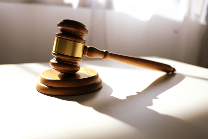 Close-Up Of Gavel On Table