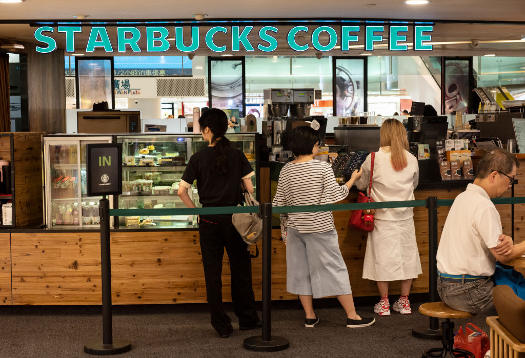 Customers seen purchasing Starbucks coffee at a shopping...