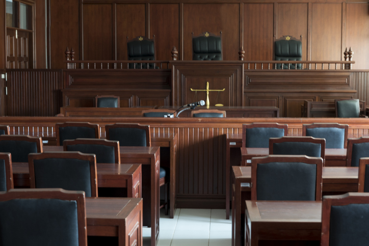 Empty Chairs And Tables In Courtroom