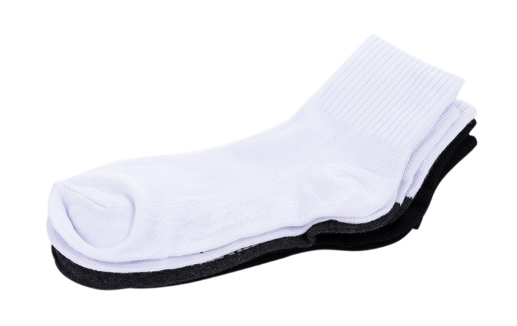 Close-Up Of Socks Over White Background