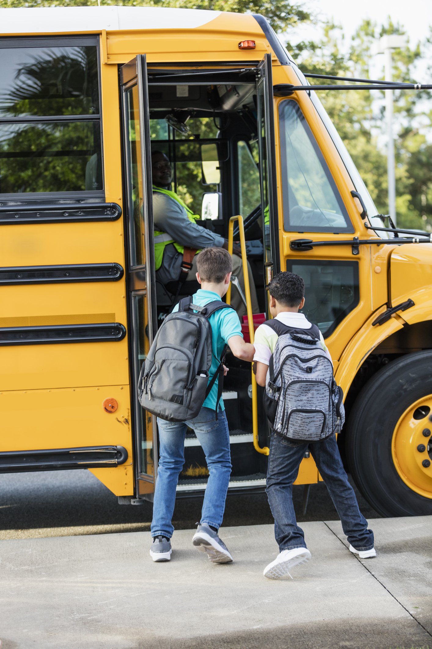Boys boarding school bus