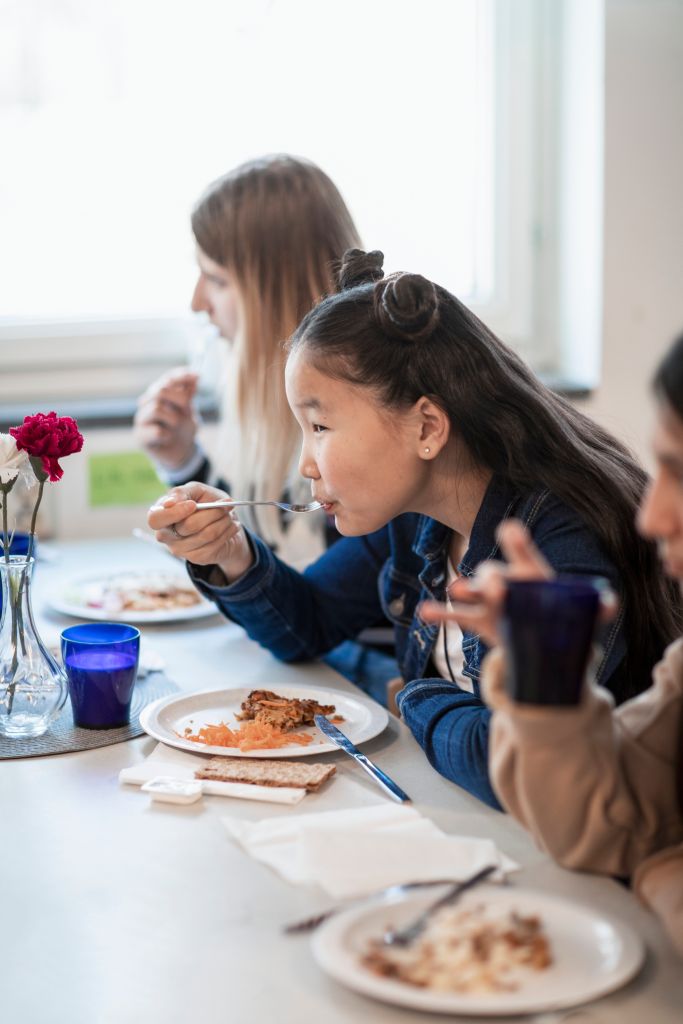 Girl eating lunch school canteen