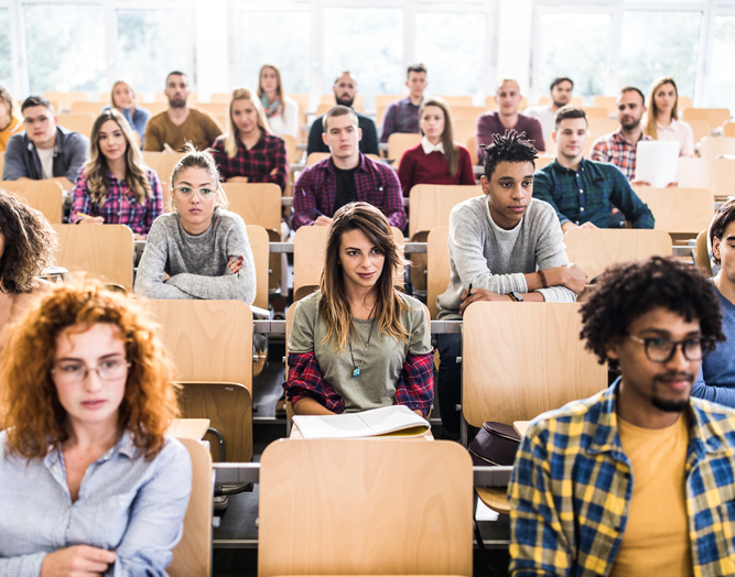 Large group of college students in a lecture hall.