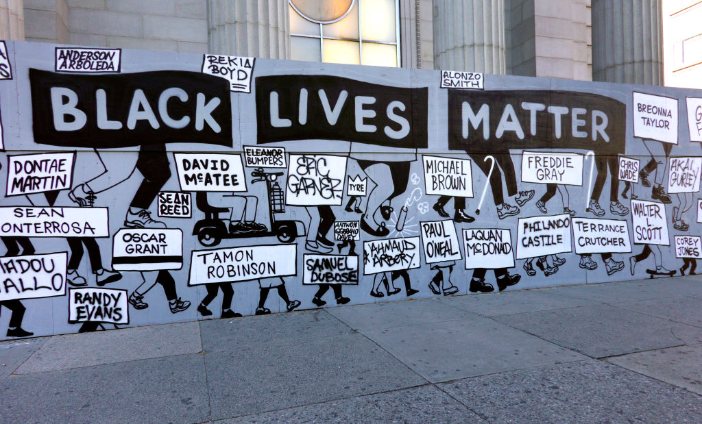 Black Lives Matter street sign depicting injustice and names of people killed by Police Brutality, New York City