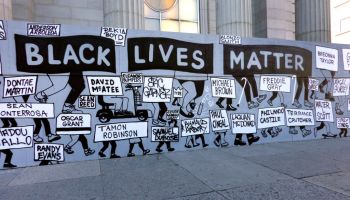 Black Lives Matter street sign depicting injustice and names of people killed by Police Brutality, New York City
