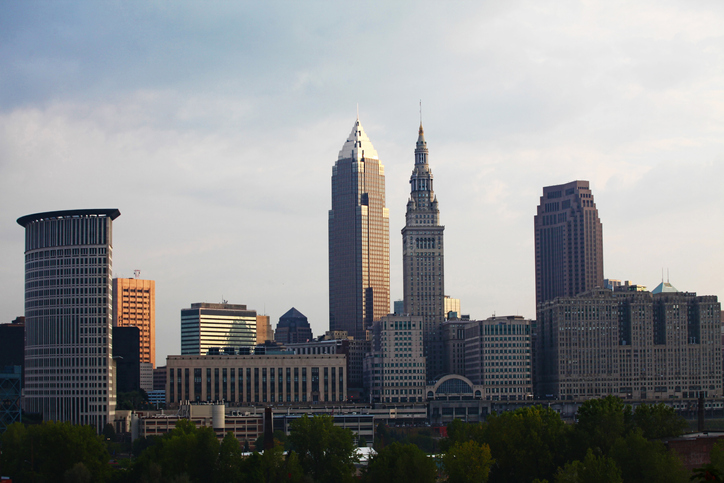 Buildings In City Against Cloudy Sky