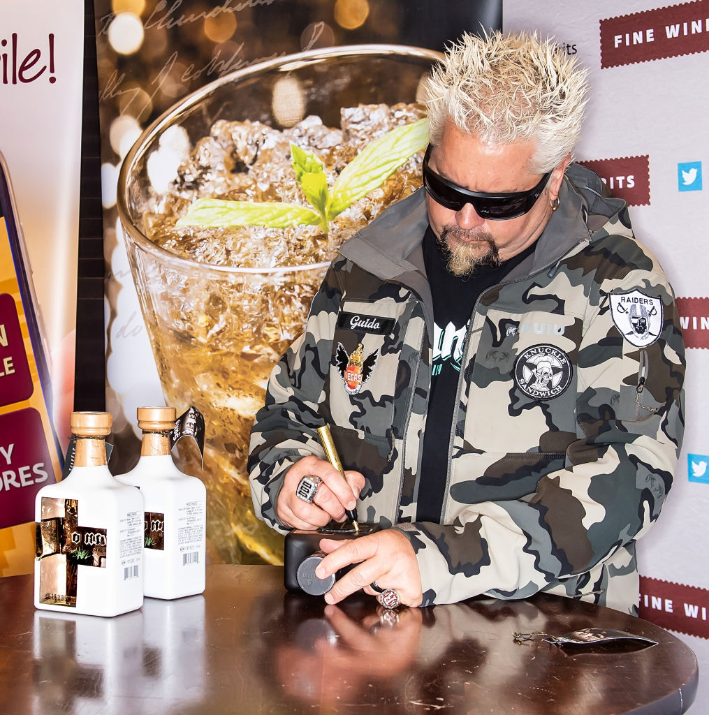 Guy Fieri Signs Bottles Of Santo Fino Tequila Blanco